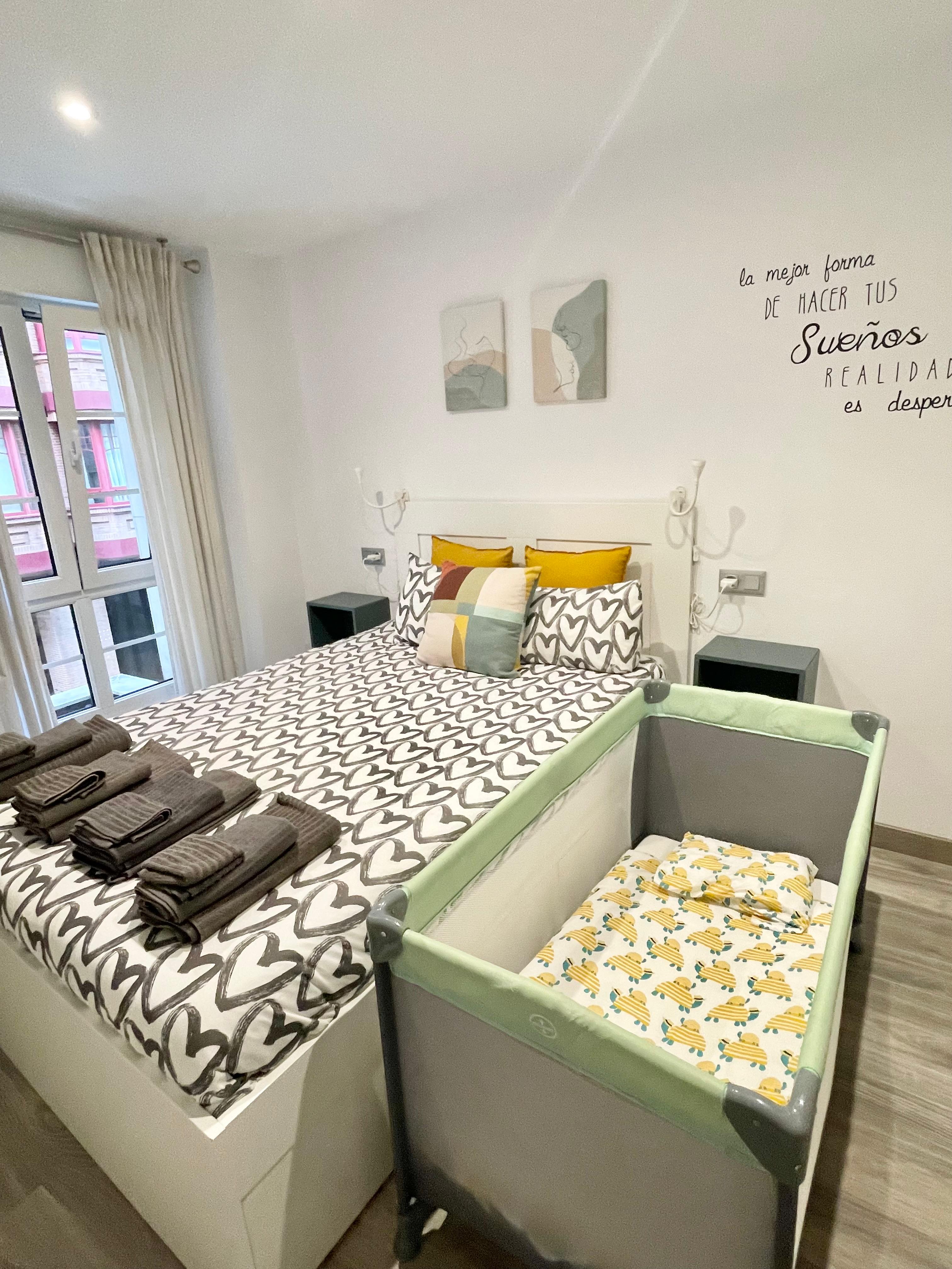 Bedroom prepared with a travel cot